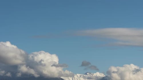 Thick Clouds Swirling Over a Mountain Range. Time-lapse.