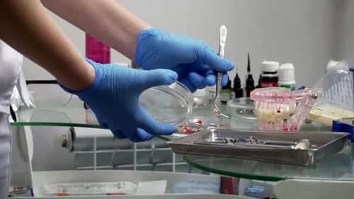 Dentist Working Closeup View of a Hands and Dental Instruments