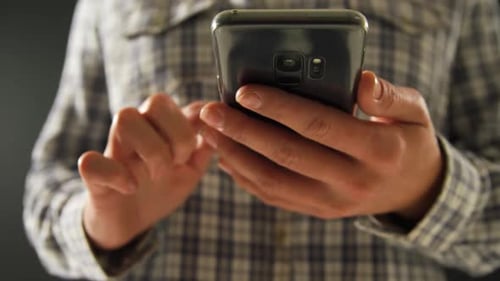 Adult Typing on Smartphone Mobile Device