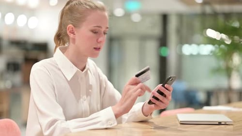 Woman Typing Credit Card Info on Smartphone