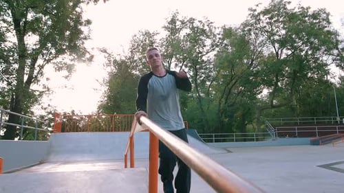 Young Man Doing Parkour Tricks in Extreme Sports Park