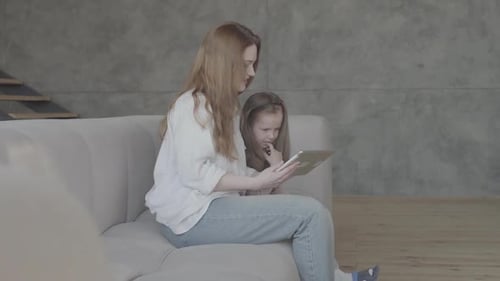 Mother and Daughter Using Tablet Together
