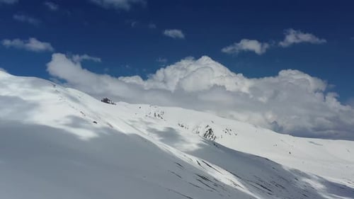 Scenic Aerial View of Snow-Capped Mountains in Winter