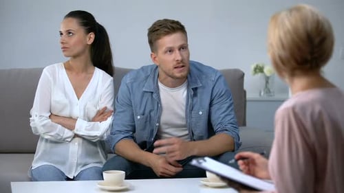 Couple Talking with Therapist in Counseling Session