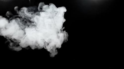 Wispy White Smoke Billowing on a Black Background