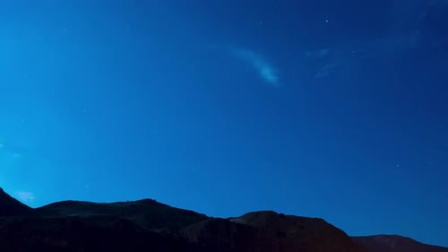Time lapse of a starry night sky clouds
