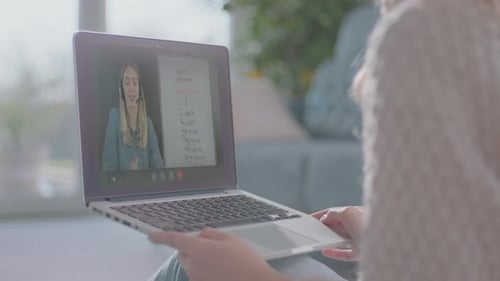 Woman Attends Online Lesson on Laptop
