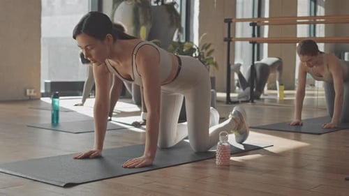 Girls Doing Glutes Exercise in Studio