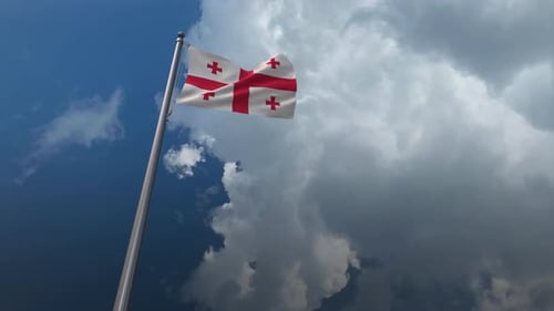 Realistic Waving Flag of Georgia Against Cloudy Sky