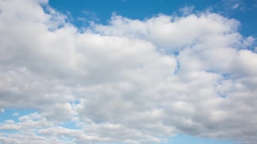 White Clouds Drifting Across a Blue Sky