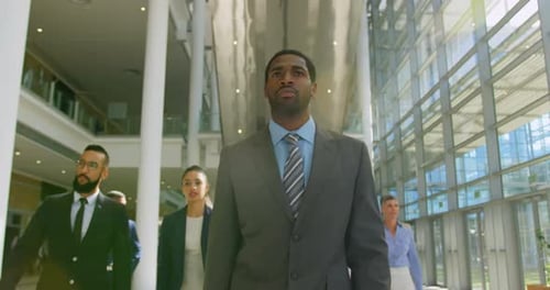 Multi ethnic business people walking together in the lobby at office 4k
