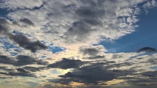 Golden Sunlight Shines Through Dramatic Clouds