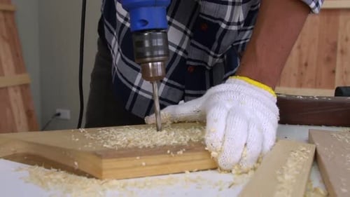 Carpenter Working on Wood Craft at Workshop