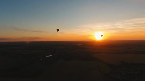Hot Air Balloon in the Sky Over a Field