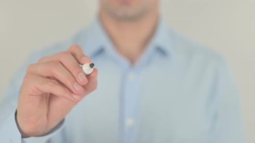 Hand Writing "Next" on Glass