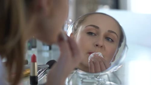 Sad Girl Removing Her Bright Makeup Looking at Reflection, Unsuccessful Date