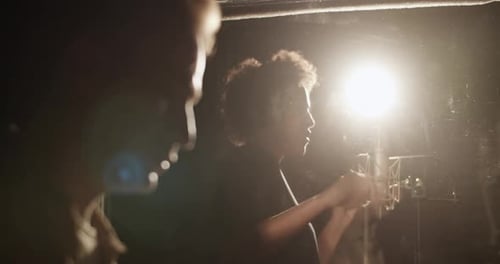 Singer Recording Vocals in Professional Recording Studio