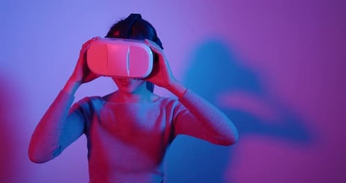 Woman looking though the virtual reality device