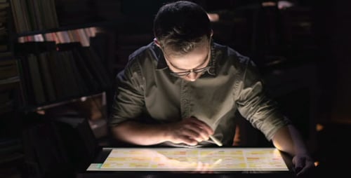Designer Working Late on Digital Interactive Display