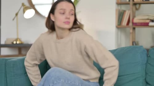 Young Woman Closing Laptop Going Away From Sofa