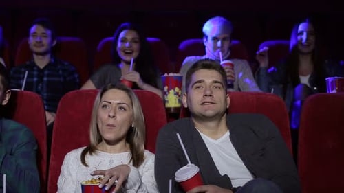 Couple Sitting Together in Cinema, Watching Comedy or Romantic Movie
