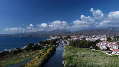 Landscape of Turkish Lands with River Lying Along the Shoreline and City Located Next to It