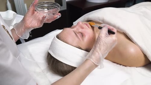 Woman Receives a Facial Treatment at a Spa