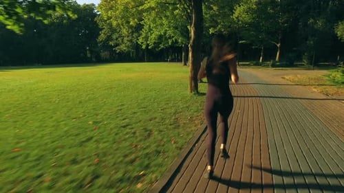 Runner Woman Running In Park Exercising Outdoors 4