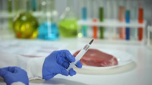 Scientist Injects Meat with Syringe in Lab