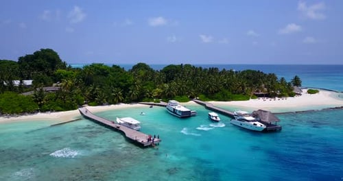 Daytime overhead island view of a summer white paradise sand beach and turquoise sea background in v