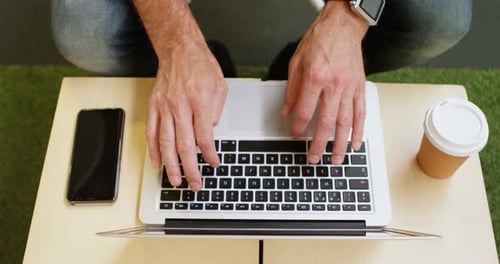 Businessman Using Laptop in Office 4k