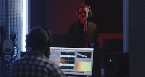 Actor Doing Voice Over in Sound Studio