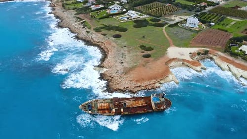 Wreck Sunken Ship in the Sea or Ocean Environmental Disaster Old Rusty Ship in Shallow Water Aerial