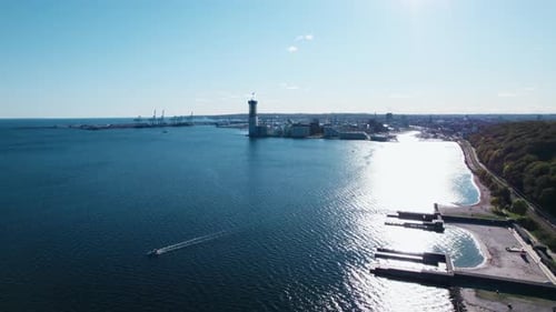 Drone Flight Over Coastline With Forest Beaches And Harbour