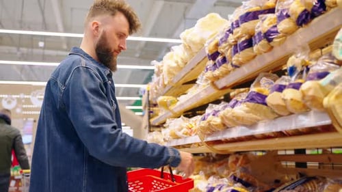 Man Buying Bread in the Supermarket After Checking Sellby Date