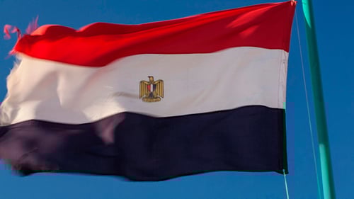 Egyptian Flag Waving Against Blue Sky