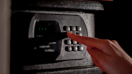 Hand Enters Code to Open and Close Digital Safe