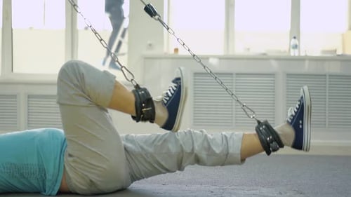 Person Performs an Exercise to Restore the Leg Muscles 1