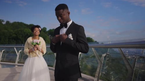 Elegant Couple Celebrating Wedding on Pedestrian Bridge