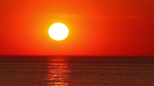 Beautiful Golden Sunset on the Sea in the Form of a Timelapse