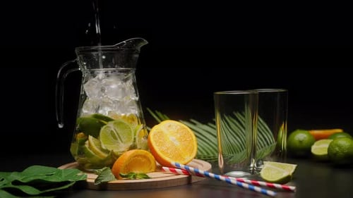 Fresh Citrus Drink with Ice Being Prepared