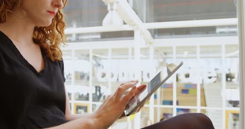 Businesswoman using digital tablet in office 4k