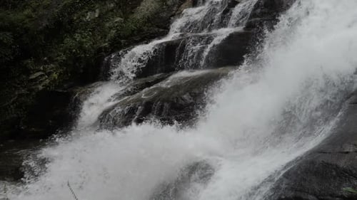 Scenic Waterfall Flowing in Natural Environment