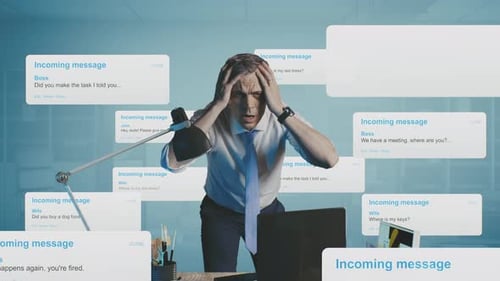 Stressed Businessman Overwhelmed by Messages in Office