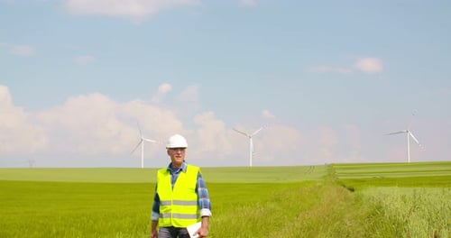 Engineer Using Digital Tablet at Windmill Farm