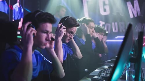 Young Gamers Putting on Headphones Before Match