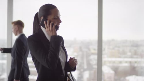Businesswoman in Suit Making Phone Call
