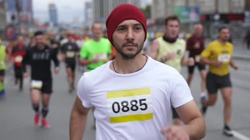 Male Runner on Marathon Race with Running Athletes
