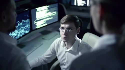 Programmer Working in Cyber Security Center at Night