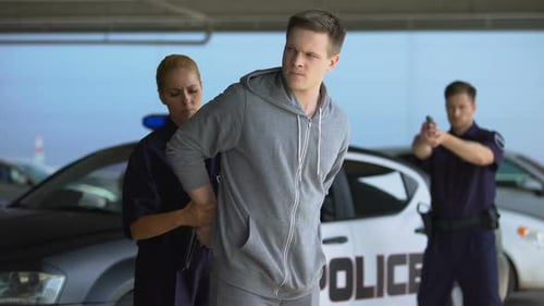 Police Officers Arrest Man in Parking Garage